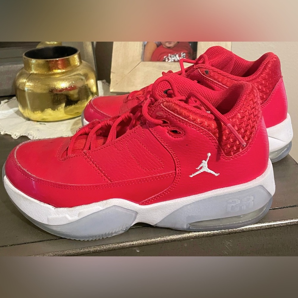 Red Jordan basketball shoes. Worn only for 6 games. Size: 5 Youth.
